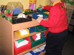A craft workstation to allow children to choose their own craft materials